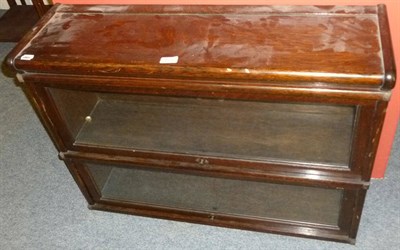 Lot 623 - An oak table canteen of plated flatware and an oak two height stacking bookcase (2)