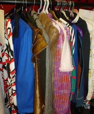 Lot 628 - A large quantity of mainly modern women's wear including dresses, purple evening dress, faux...