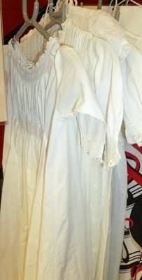 Lot 629 - Four late 19th century child's Christening/night gown, underdress and later white dress