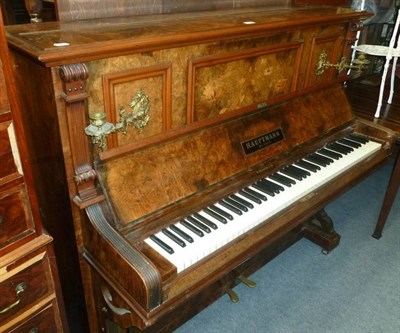 Lot 645 - A figured walnut upright piano signed Hauptmann, Berlin