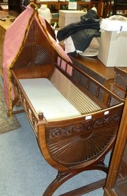 Lot 659 - Mahogany and cane cot in Adam's style