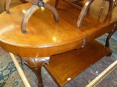 Lot 662 - Mahogany and walnut wind action dining table and sideboard