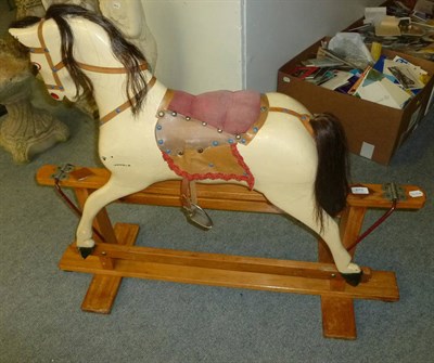 Lot 670 - Circa 1930's cream painted rocking horse on treadle base