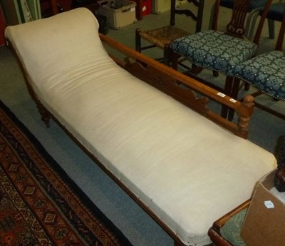 Lot 693 - Late 19th/early 20th century carved walnut chaise longue