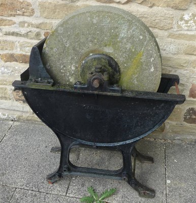 Lot 757 - A grinding wheel in frame