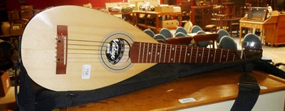 Lot 758 - A travelling guitar by Vintage, model VTG1 in case