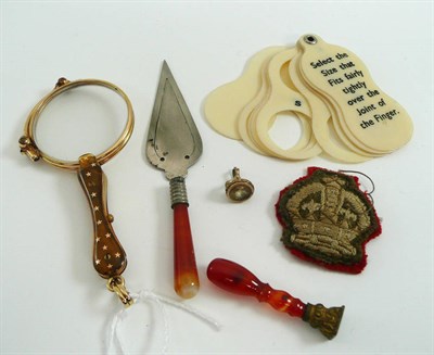 Lot 9 - # A small group of curios, including a lorgnette, seals, a badge etc