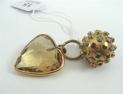 Lot 15 - # A Quartz heart shaped pendant, the faceted smokey quartz heart in a yellow bezel setting, on...