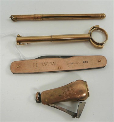 Lot 44 - # Four accessories - a 9ct gold penknife, a cocktail stirrer, a 9ct curio and a cigar cutter