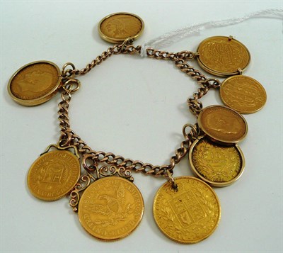 Lot 52 - A bracelet hung with assorted drilled, soldered and loose mounted coins including two full...
