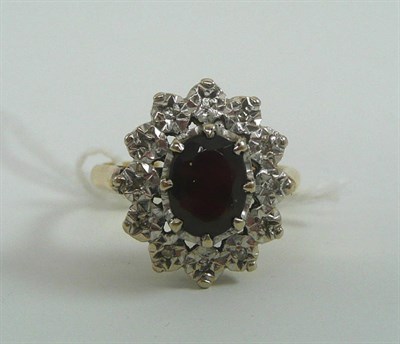 Lot 54 - An 18ct gold garnet and diamond cluster ring