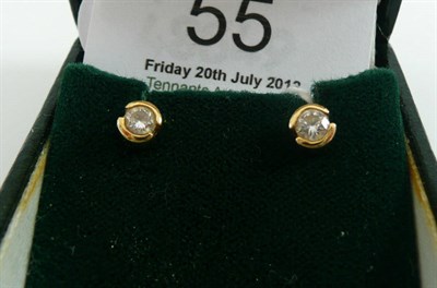Lot 55 - A pair of 18ct gold diamond solitaire earrings