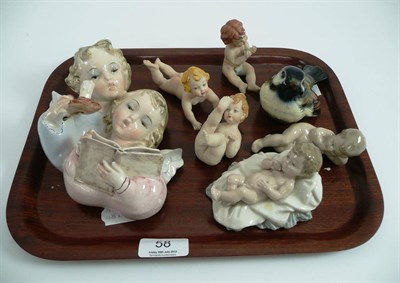 Lot 58 - Three Naples bisque baby figures, Goebels bird, two Nao groups of young boys and a Continental wall