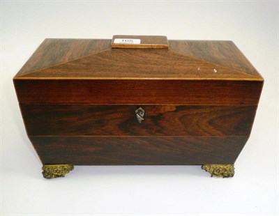 Lot 105 - # A Regency rosewood tea caddy, of sarcophagus form, containing a central glass bowl flanked by two