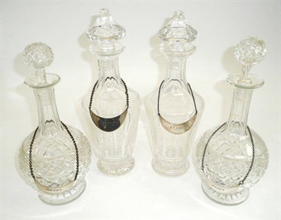 Lot 111 - # A pair of Shaft and Globe decanters, 19th century, with bands of strawberry and star cutting,...