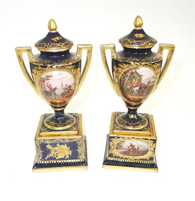 Lot 113 - # A pair of Vienna style twin-handled vases and covers, late 19th century, of urn shape on...