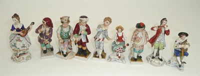 Lot 121 - # A set of four German porcelain figures representing months, 10cm high, a similar figure, a...