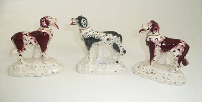 Lot 123 - A pair of Staffordshire porcelain figures of dogs and another dog