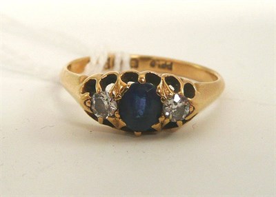 Lot 163 - An 18ct gold sapphire and diamond three stone ring