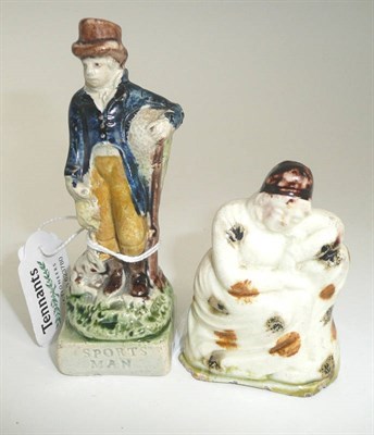 Lot 176 - A Prattware standing figure "Sportsman", circa 1810, as a gentleman wearing a brown top hat,...