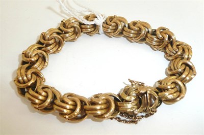 Lot 180 - # A fancy link bracelet, conjoined textured hoops along the length, measures 20cm