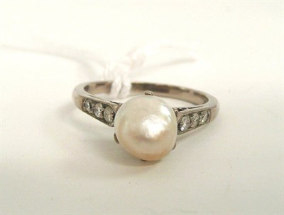 Lot 195 - # A pearl and diamond ring, an irregular shaped pearl in a white claw setting, to pointed shoulders