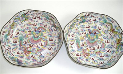 Lot 207 - A pair of Chinese Canton enamel hexagonal dragon bowls, 19th century, internally painted with a...