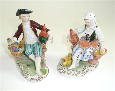 Lot 210 - # A pair of Carl Thieme Potschappel porcelain figures of a girl and boy, 20th century, each in 18th