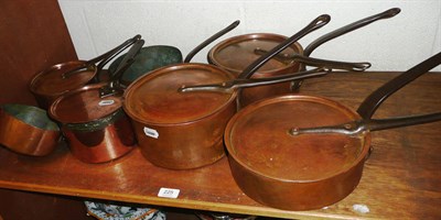 Lot 225 - Graduated copper pans and lids