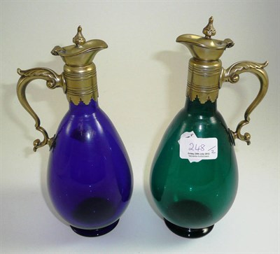 Lot 248 - A blue claret jug and a green claret jug (2)