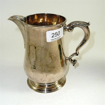 Lot 250 - A George II jug, Thomas Cooke II & Richard Gurney, London 1752, with acanthus capped S scroll...