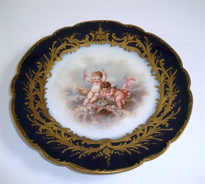 Lot 253 - # A Sèvres style porcelain cabinet plate, 19th century, painted by Ray with putti amongst clouds