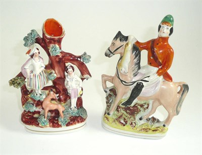 Lot 265 - A Staffordshire spill vase modelled with figures and a stag and a horseman