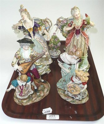 Lot 284 - Two pairs of Continental figures (a.f.) and a pair of floral encrusted vases