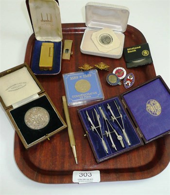 Lot 303 - # A 9ct gold cigar cutter, a gold plated Dunhill lighter, a gold plated propelling pencil, a silver