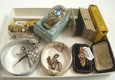 Lot 315 - A brooch stamped '15ct', costume jewellery, a bracelet and three bangles, and cigarette cards