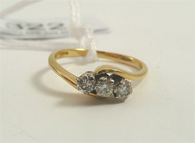 Lot 322 - A three stone diamond ring