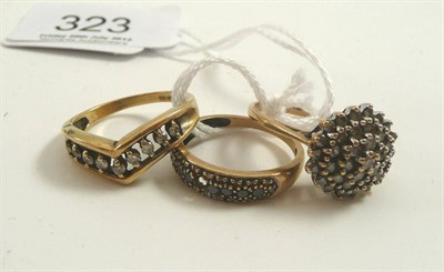 Lot 323 - A cluster ring, a dress ring stamped '375' and a yellow metal dress ring