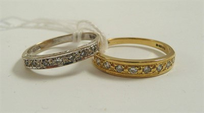 Lot 336 - Two diamond set 18ct gold half hoop rings