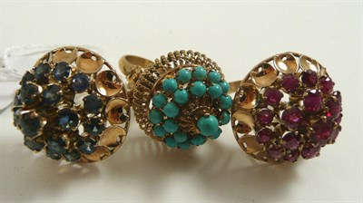 Lot 341 - # A ruby ring, a sapphire ring and a turquoise ring, all of bombé style, all finger size M