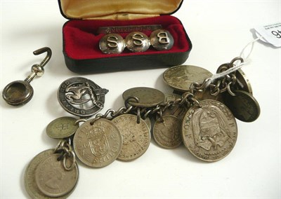 Lot 346 - # A small quantity of jewellery, including a coin bracelet, a silver brooch, a silver napkin...