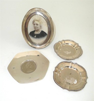 Lot 348 - # Oval silver photo frame and three small silver dishes