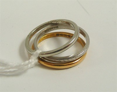 Lot 352 - A 22ct gold band ring, platinum band ring and 18ct white gold ring (3)