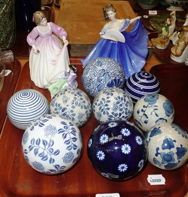 Lot 368 - Three Royal Doulton figures and a collection of blue and white carpet bowls