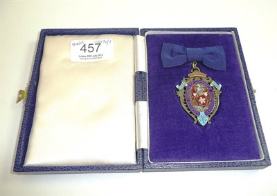 Lot 457 - # A silver gilt and enamel commerce badge, cased