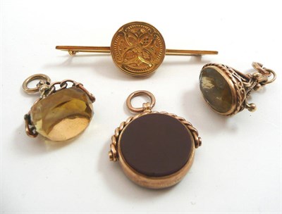 Lot 464 - Three gilt fobs and a 9ct gold bar brooch