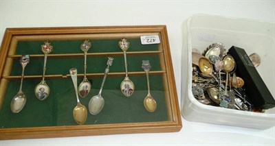 Lot 472 - A collection of silver and white metal souvenir spoons, some enamelled