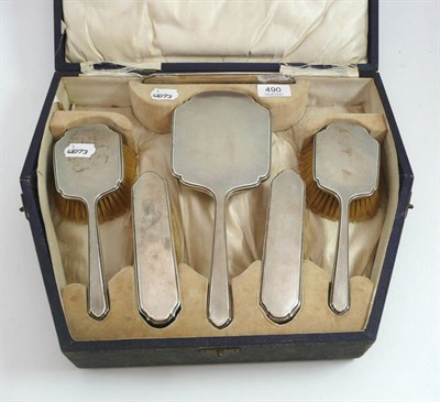 Lot 490 - A cased Walker & Hall silver mounted dressing table set