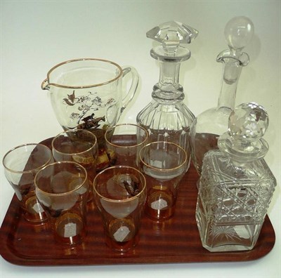 Lot 511 - A seven piece glass 'Hunting' lemonade set, three Victorian decanters and stoppers