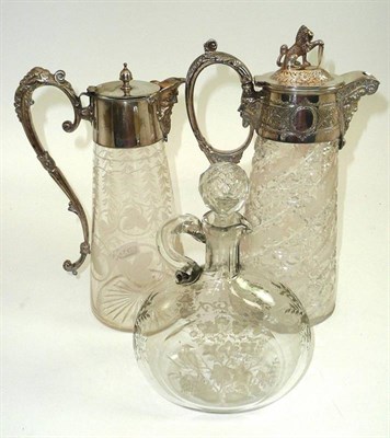 Lot 517 - # A silver plate mounted glass claret jug, late 19th century, of oval section with lion knop...